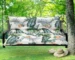 Outdoor bench cushion on a wooden garden bench with vibrant floral pattern
