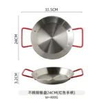 Stainless steel paella pan with double ears on a stove