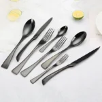 Luxury black 18/10 stainless steel cutlery set arranged on a table