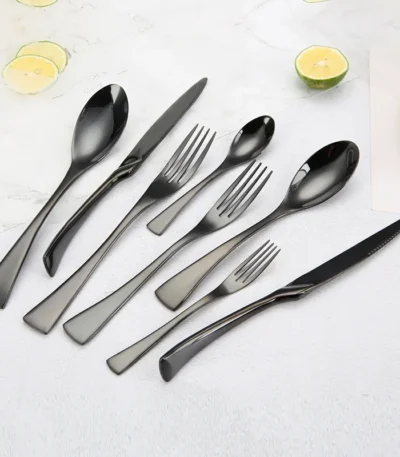 Luxury black 18/10 stainless steel cutlery set arranged on a table