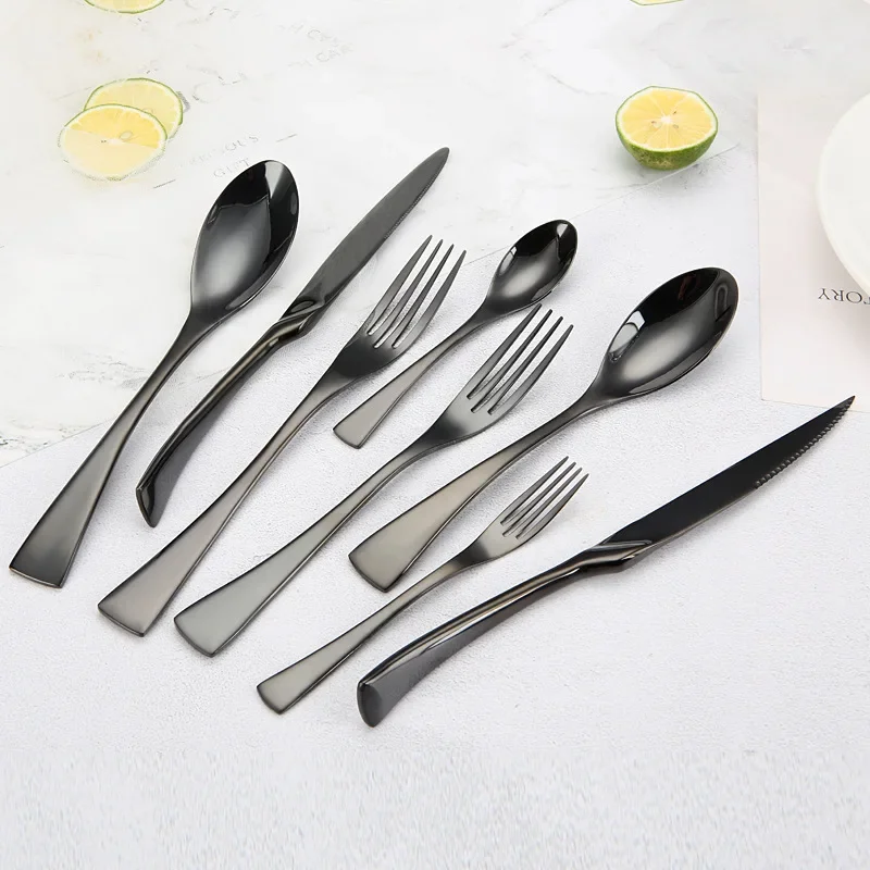 Luxury black 18/10 stainless steel cutlery set arranged on a table