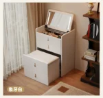 Wooden makeup vanity with mirror and stool in a modern bedroom setting