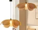 Handwoven rattan ceiling light in a modern dining room setting