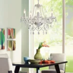 Elegant crystal chandelier illuminating a modern living room with sparkling light