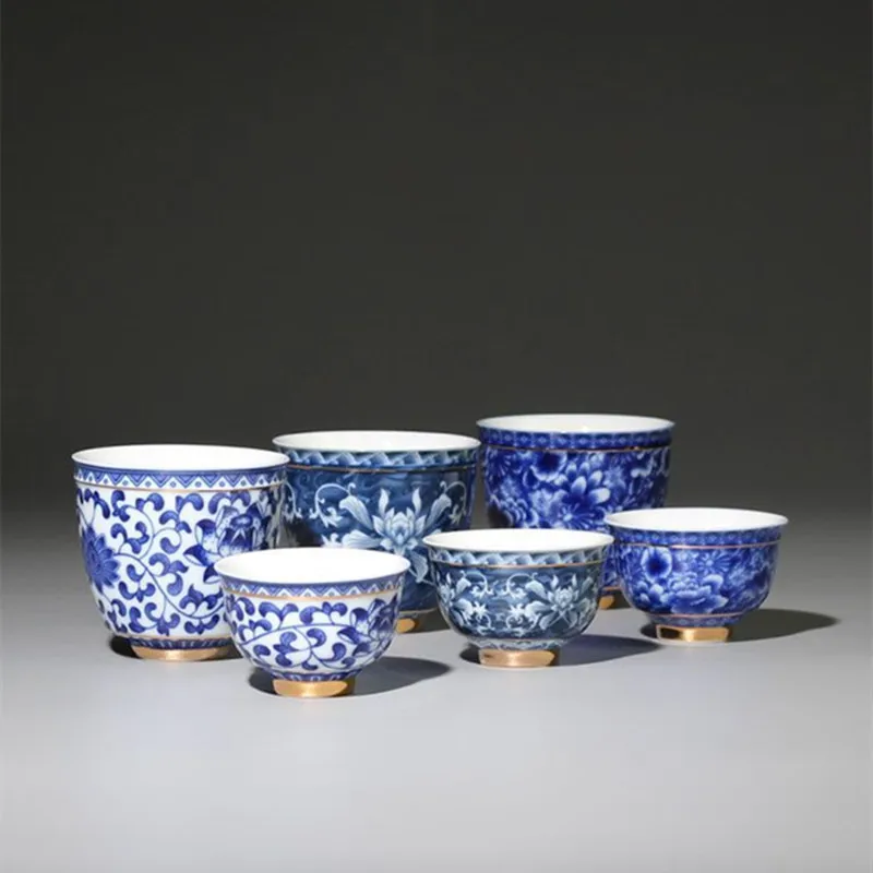Elegant blue and white porcelain tea cup on wooden table
