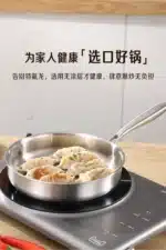 Uncoated 22-32cm frying pan, metal stainless steel frying pan, steak frying pan – in a cozy room setting
