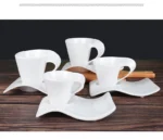 White porcelain espresso cup with wavy design on saucer, modern home decor