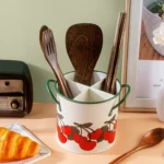 4-grid iron kitchen utensil storage box with chopsticks, spoons, and forks neatly organized on a countertop