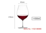Kimura Shouko ultra thin wine glass on a wooden table, catching light
