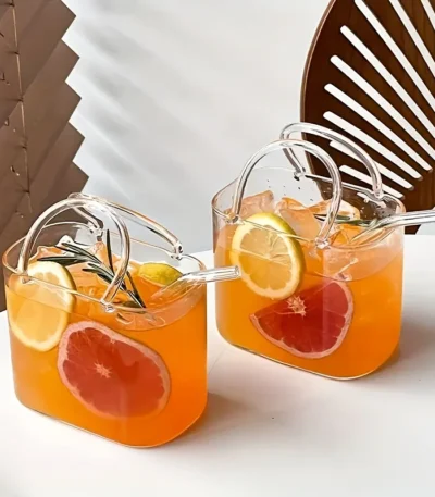 Korean ins style handbag shaped glass cup with straw on table