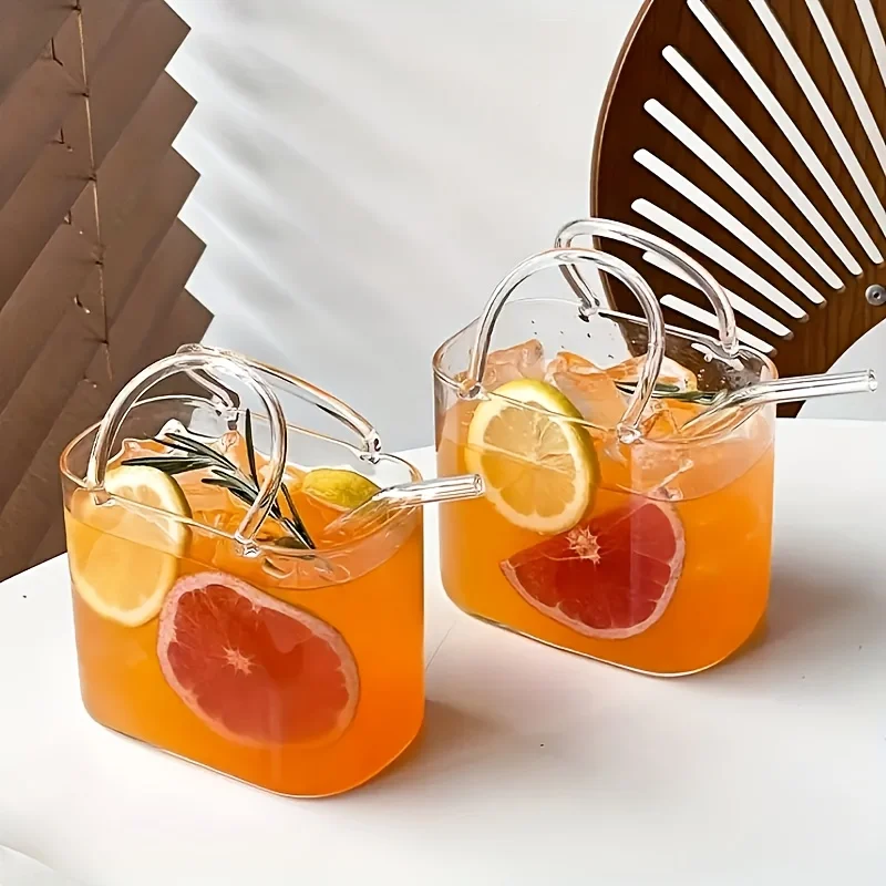 S8a5ca9026b4d4f1fa256ef1bf9a5b8f9N.webp Korean ins style handbag shaped glass cup with straw on table
