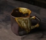 Japanese simple stoneware coffee cup on wooden table
