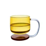 Colorful borosilicate glass drinking glasses on a wooden table