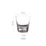 Transparent snow mountain whiskey glasses with Mount Fuji shape on a wooden table