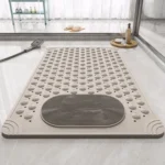 Oblong non-slip bath mat with suction cups on shower floor