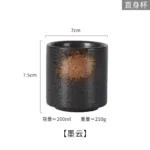 Japanese ceramic beer mug filled with amber ale, showcasing traditional glaze and ergonomic handle