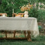 Retro polka dot tablecloth with fringe on a wooden table