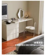 Modern vanity table with mirror and drawers in a bedroom setting