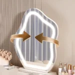 Modern wood makeup vanity table with mirror, drawer, and stool in a bedroom setting