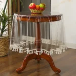 Elegant waterproof table cover with retro fringed lace on a dining table