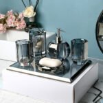Lotion bottle with pump, reflection on mirror.
