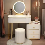 French white wooden dressing table with mirror and stool in a modern bedroom setting