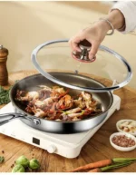 Goldoma titanium frying pan with nonstick surface on induction cooktop
