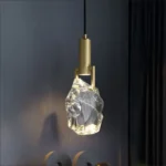 Modern crystal pendant lamp illuminating a dining room with elegant light refraction