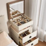 Modern lifting vanity table with mirror in cream finish, featuring rotating top and adjustable height for bedroom use