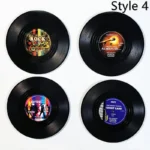 Set of vinyl record coasters on a wooden table