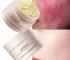 Facial redness repair cream in a white tube with red accents, on a clean bathroom counter.