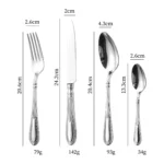 Elegant stainless steel flatware set with mirror finish arranged on a wooden table