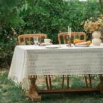 Retro polka dot tablecloth with fringe on a wooden table