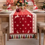 Red and green Christmas table runner with plaid pattern on dining table