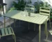 Metal patio dining table with chairs on a deck