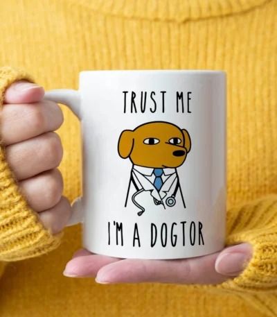 Dogtor coffee mug with playful text on a desk, ceramic doctor gift mug
