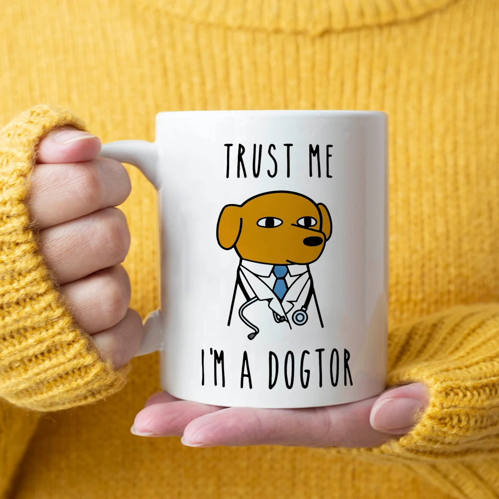 S952f9fbd43fd44cd9eb8f4644dbb02e30.webp Dogtor coffee mug with playful text on a desk, ceramic doctor gift mug