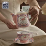 Elegant porcelain cups and saucers set on a wooden table