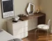 Modern vanity table with mirror and drawers in a chic bedroom setup
