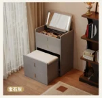 Wooden makeup vanity with mirror and stool in a modern bedroom setting