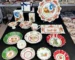 Christmas dinner plates with festive holly and berry pattern on a wooden table