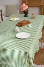 French country tablecloth with retro plaid pattern and lotus leaf edge on a dining table