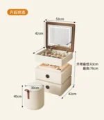 Modern lifting vanity table with mirror in cream finish, featuring rotating top and adjustable height for bedroom use