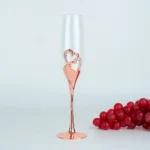 Elegant crystal champagne glasses set on a table with sparkling wine