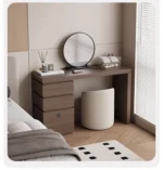 Minimalist wood dressing table with mirror and three storage drawers in modern bedroom setting