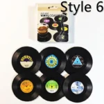 Set of vinyl record coasters on a wooden table