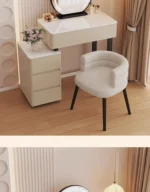 Modern vanity table with mirror and storage drawers in a bedroom setting