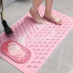 Oblong non-slip bath mat with suction cups on shower floor