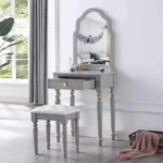 Modern white dressing table with mirror and stool in a bedroom setting