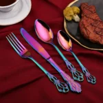 24-piece stainless steel cutlery set with gold handles displayed on a wooden table